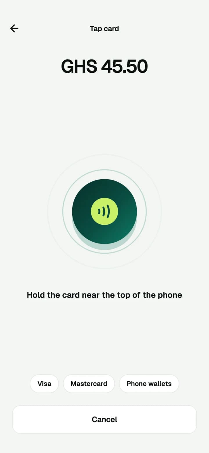 The merchant app asking the customer to hold their card near the phone